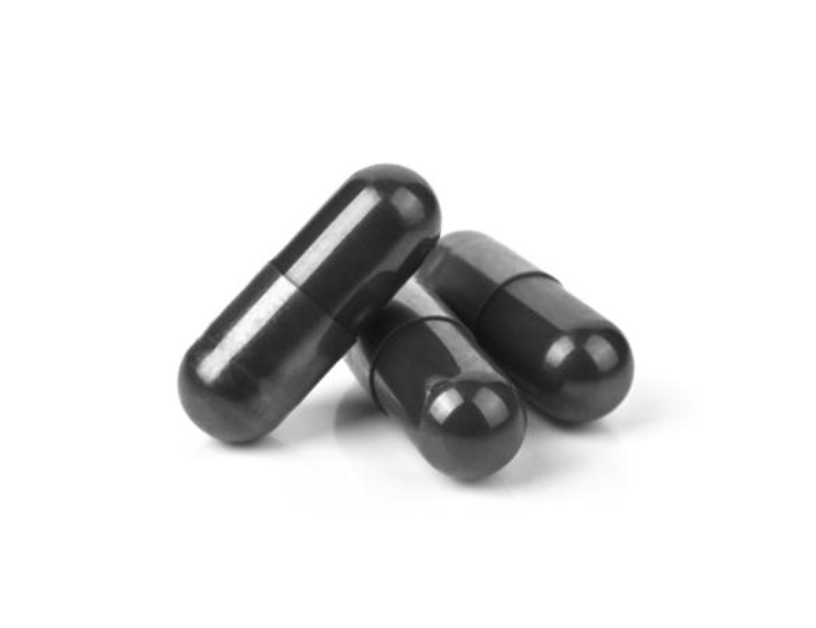 Three black cylindrical objects on a white background