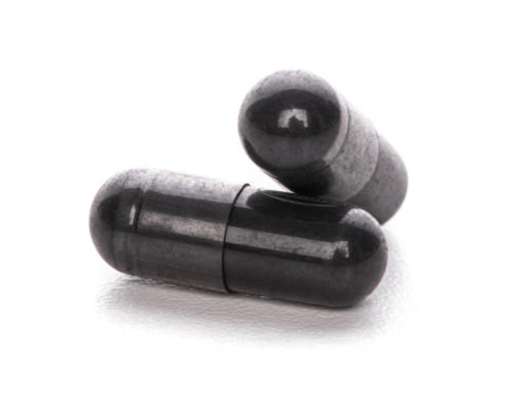 Two black capsules on a white background